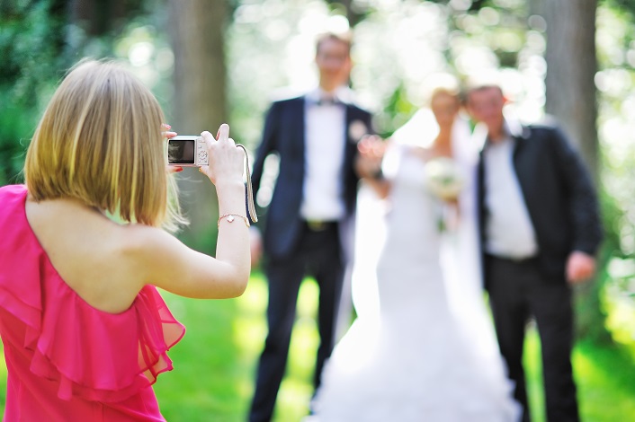 bride and groom at wedding with guests