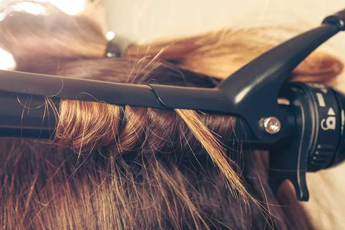 Using flat iron or heating tools without a heat protectant.