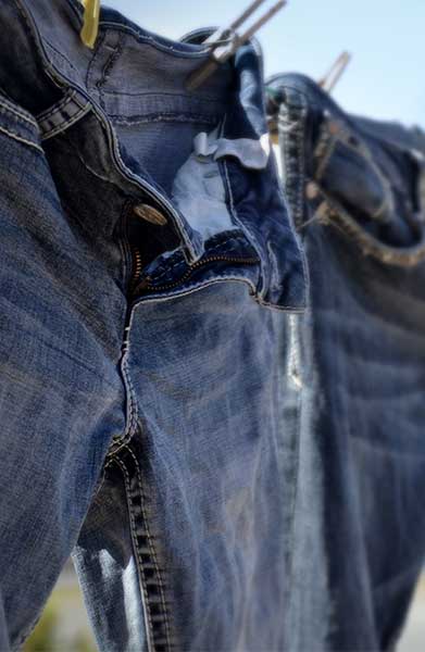 how-to-wash-jeans-without-shrinking-them-shefinds