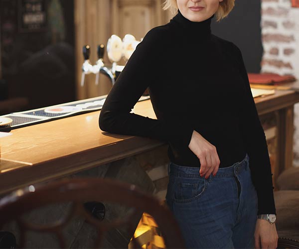 Woman behind bar