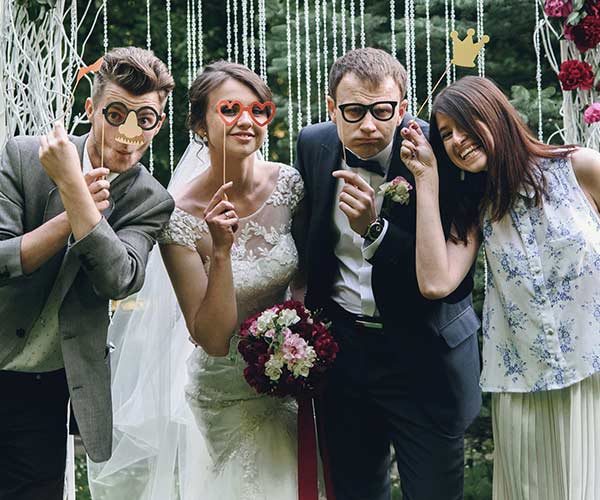 Bride and guests with props