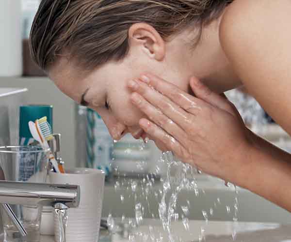 woman washing face