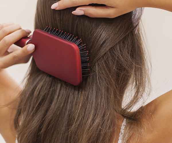 woman brushing hair