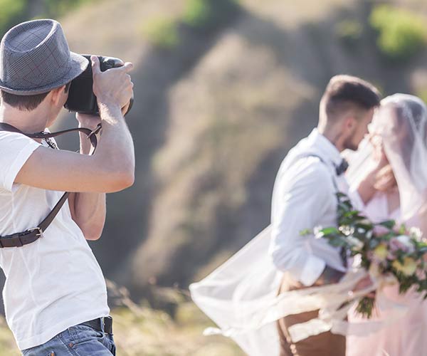 Photographer with couple