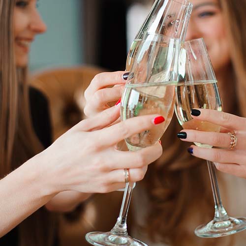 women toasting champagne