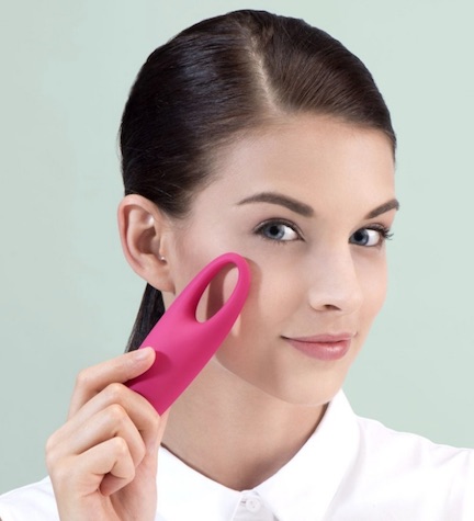 woman using foreo iris massager