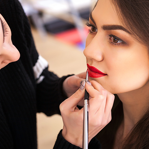 woman getting her makeup done