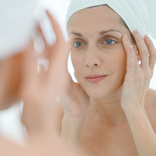 woman using skincare products