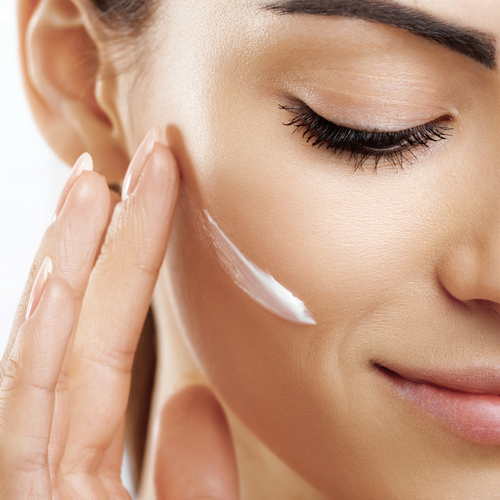 woman applying night cream