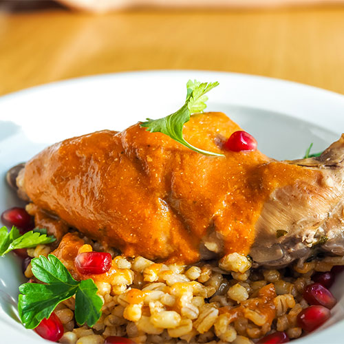 Harissa chicken in a bowl.