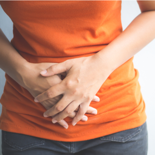 woman holding stomach