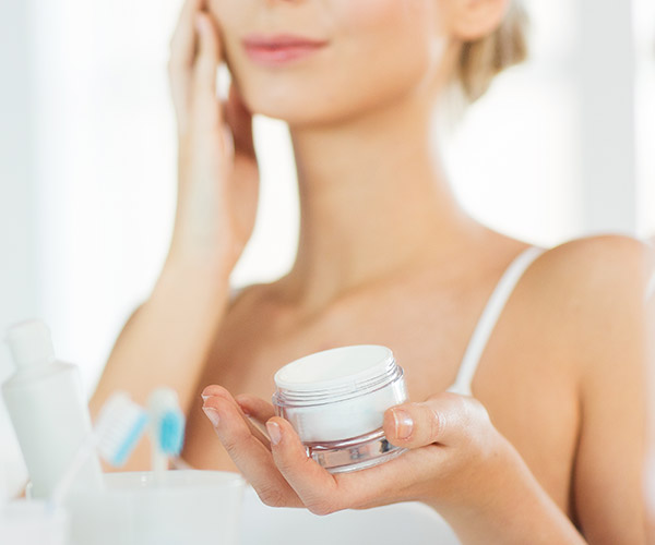 woman applying cream