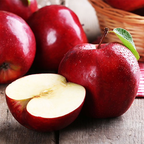 Red apples on a table.