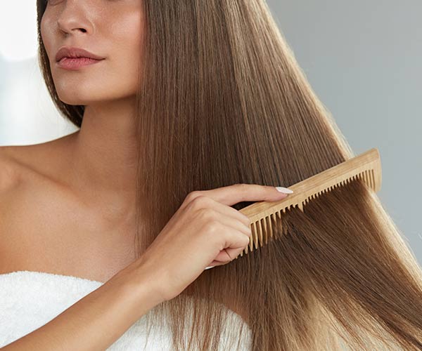 woman combing hair