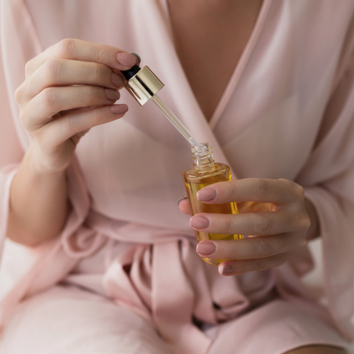 woman holding serum