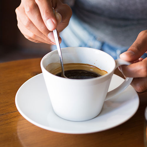 stirring coffee