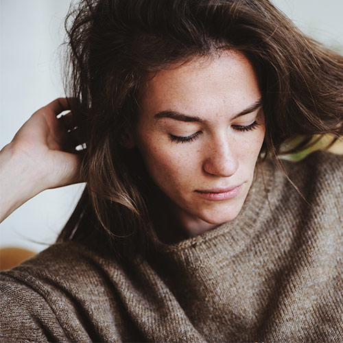 woman playing with hair