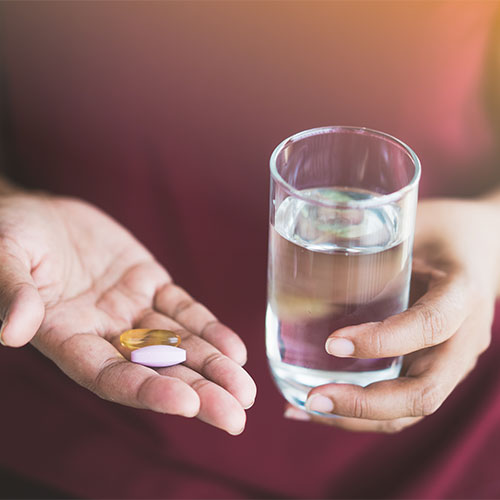 woman taking vitamins