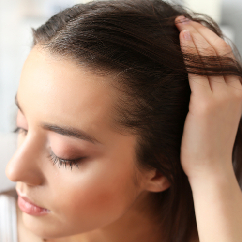 woman touching hair