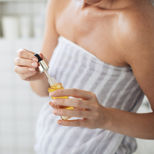 woman holding serum