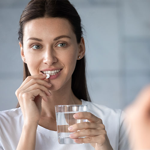 woman taking vitamin