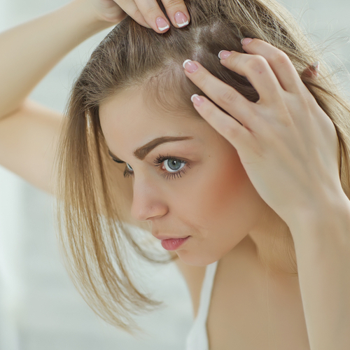 woman touching hair