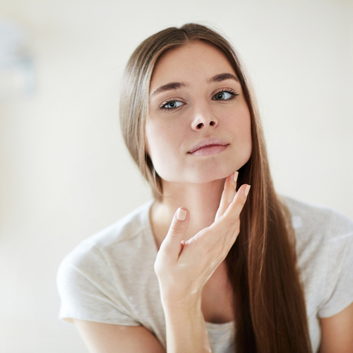 woman looking at face