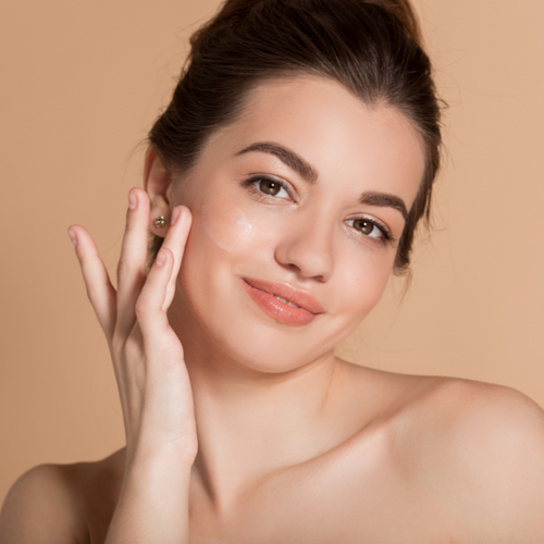 woman applying serum