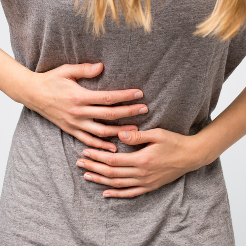 woman holding stomach