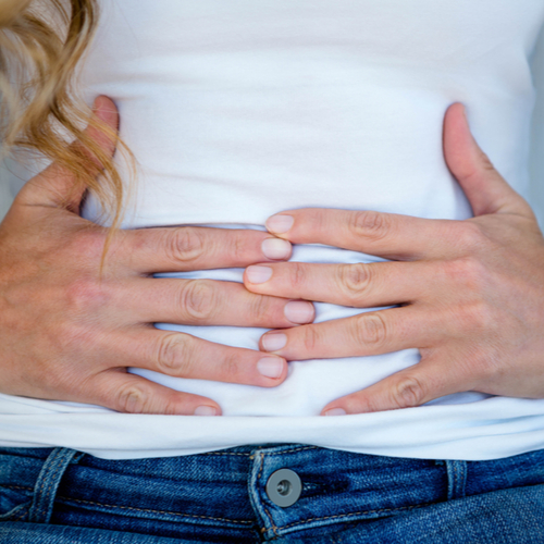 woman holding stomach