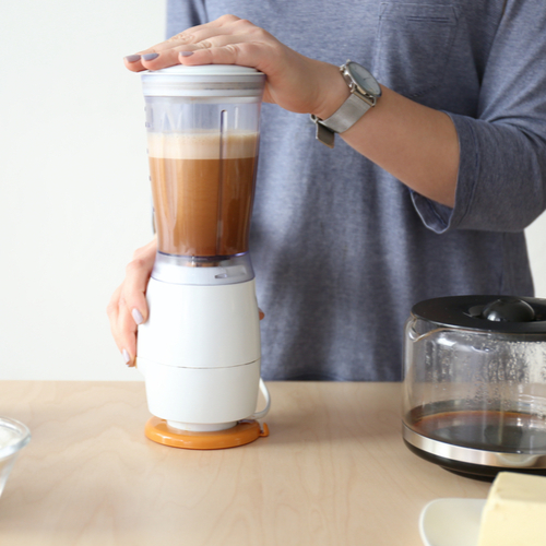 woman blending coffee