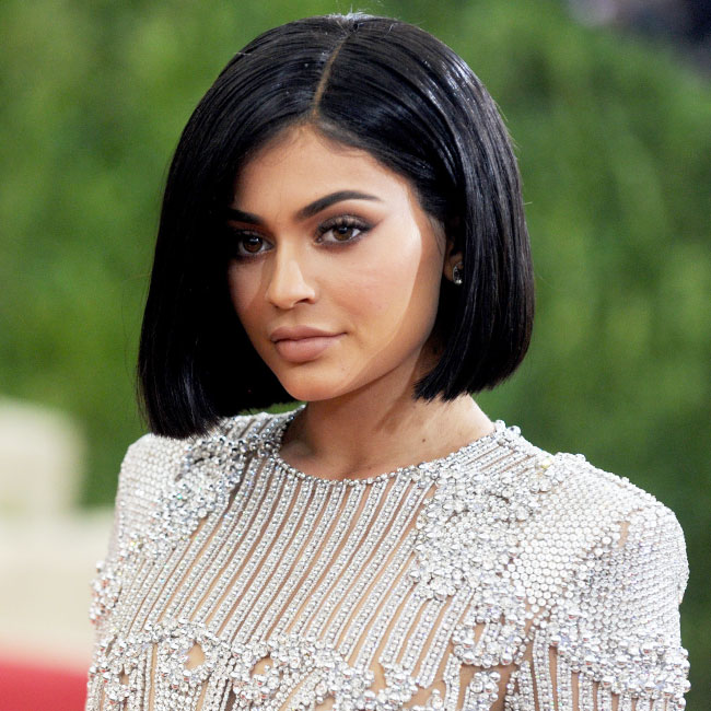 Kylie Jenner still sizzles covered up in Chanel top and leggings that show  her curves