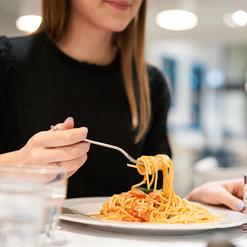 woman eating pasta