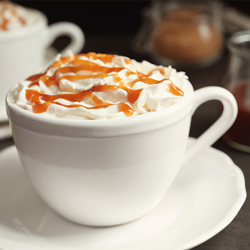 coffee drink with whipped cream and caramel syrup