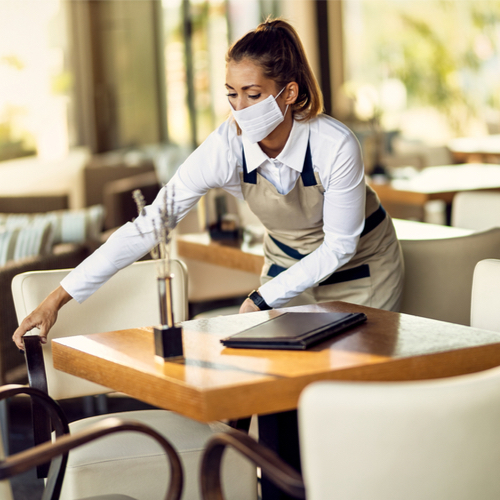 waitress wiping off table