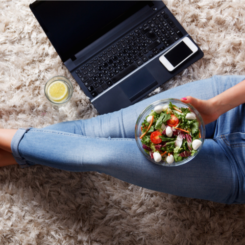 woman eating salad