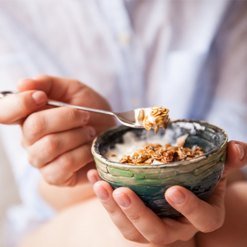 woman eating granola