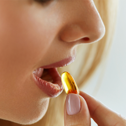 woman taking supplement