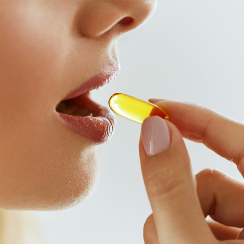 woman taking supplement