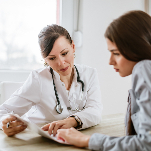 woman speaking to doctor