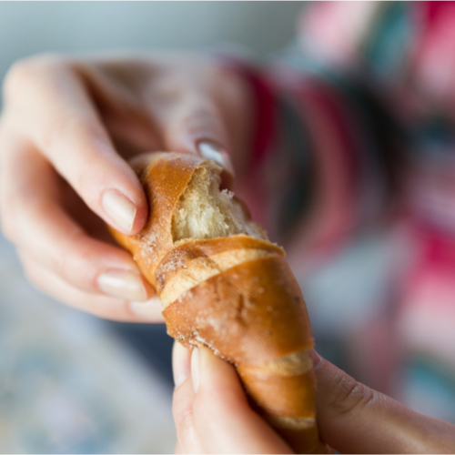 woman eating bread