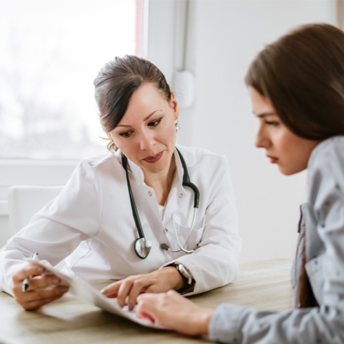 woman talking to doctor