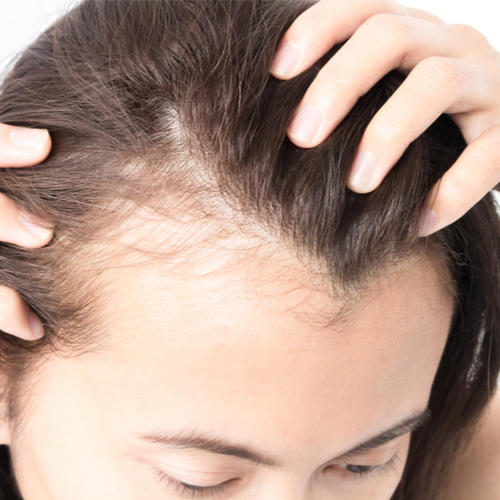 woman touching hair