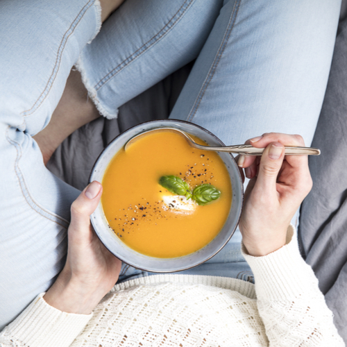 woman eating soup