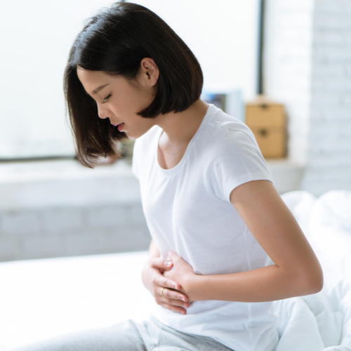 woman holding stomach