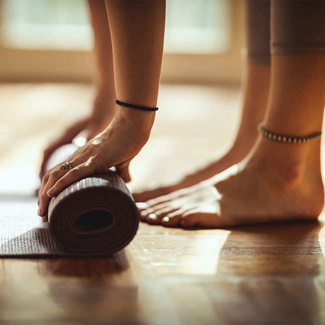 Trainers Agree: These Are The 4 Best Morning Stretches For A Flat