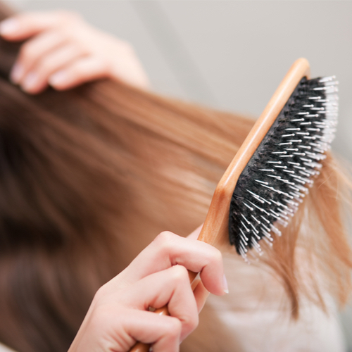 woman brushing hair