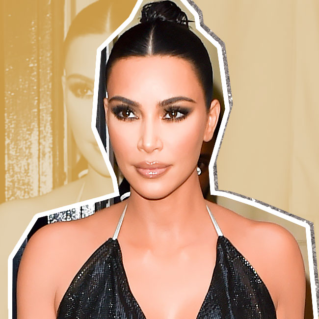 Kim Kardashian Wears Diamond 'Saint' Necklace With Skintight Bodysuit