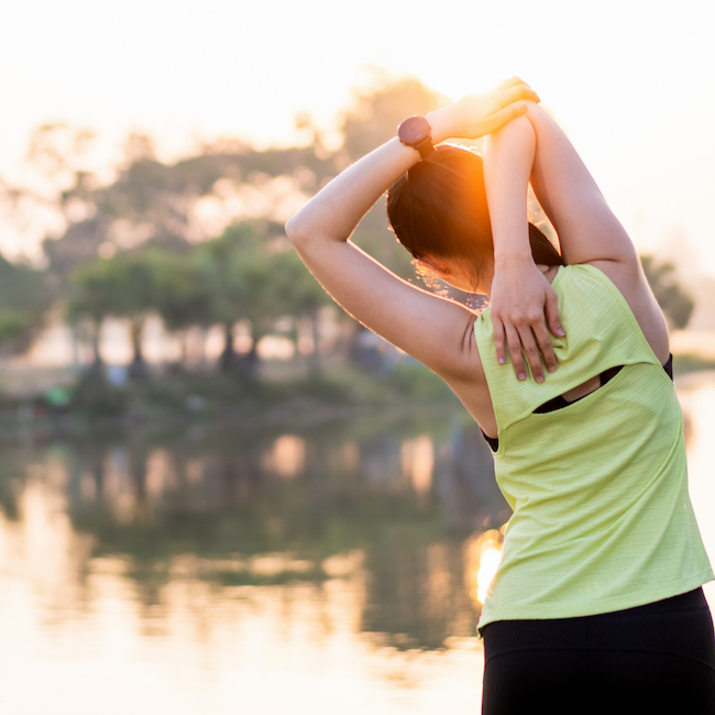 woman stretching outdoors