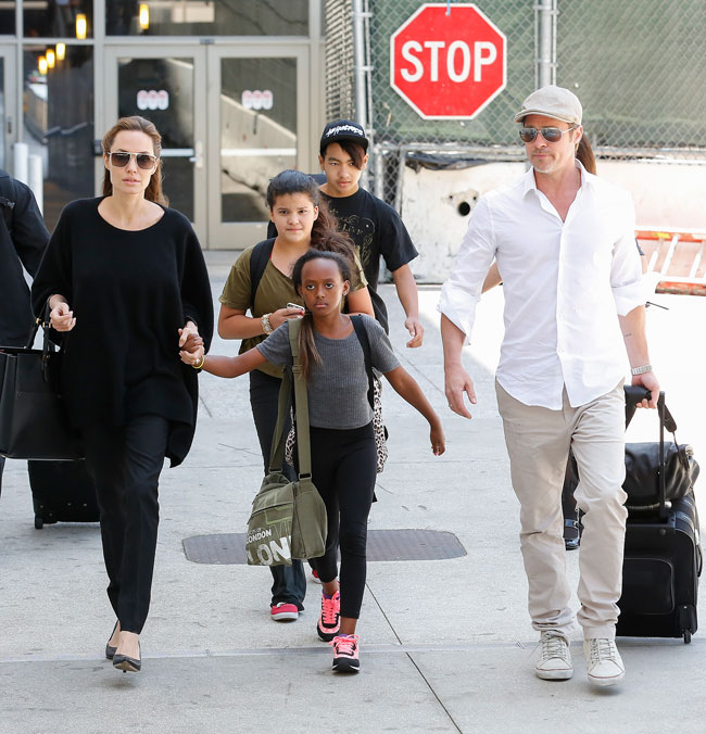 Angelina Jolie holds hands with son Knox at LA airport